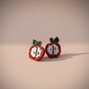 1. handmade crochet apple earrings in red and white yarn