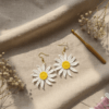 Bright, joyful, and beautifully handmade — The Daisy Loops crochet earrings bring the charm of blooming daisies to your look. Lightweight, artisanal, and crafted with love for everyday sunshine vibes.